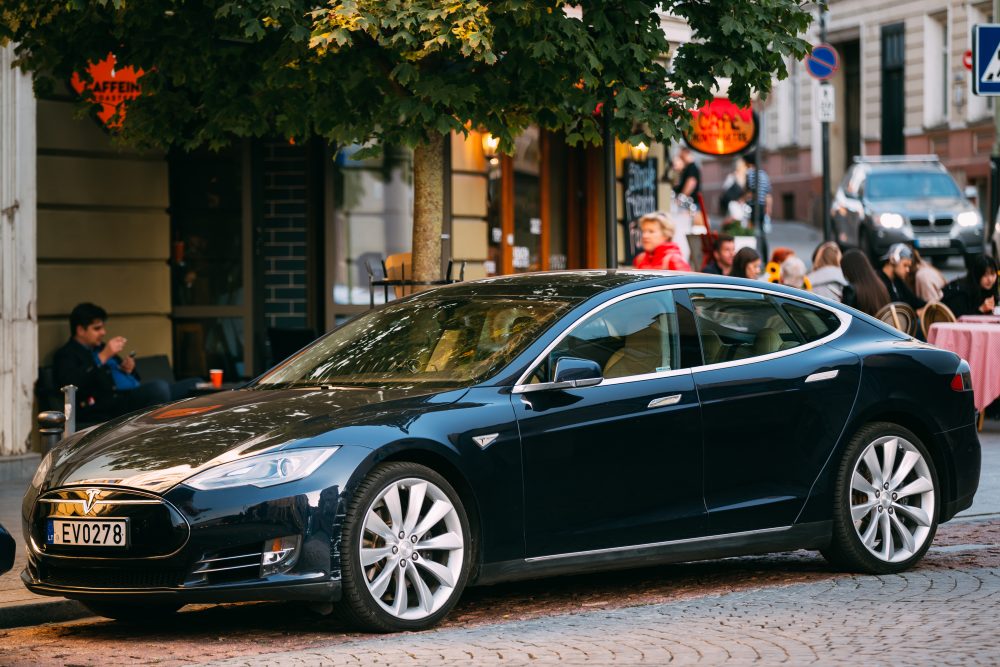 Tesla Model S Car In Motion On Street